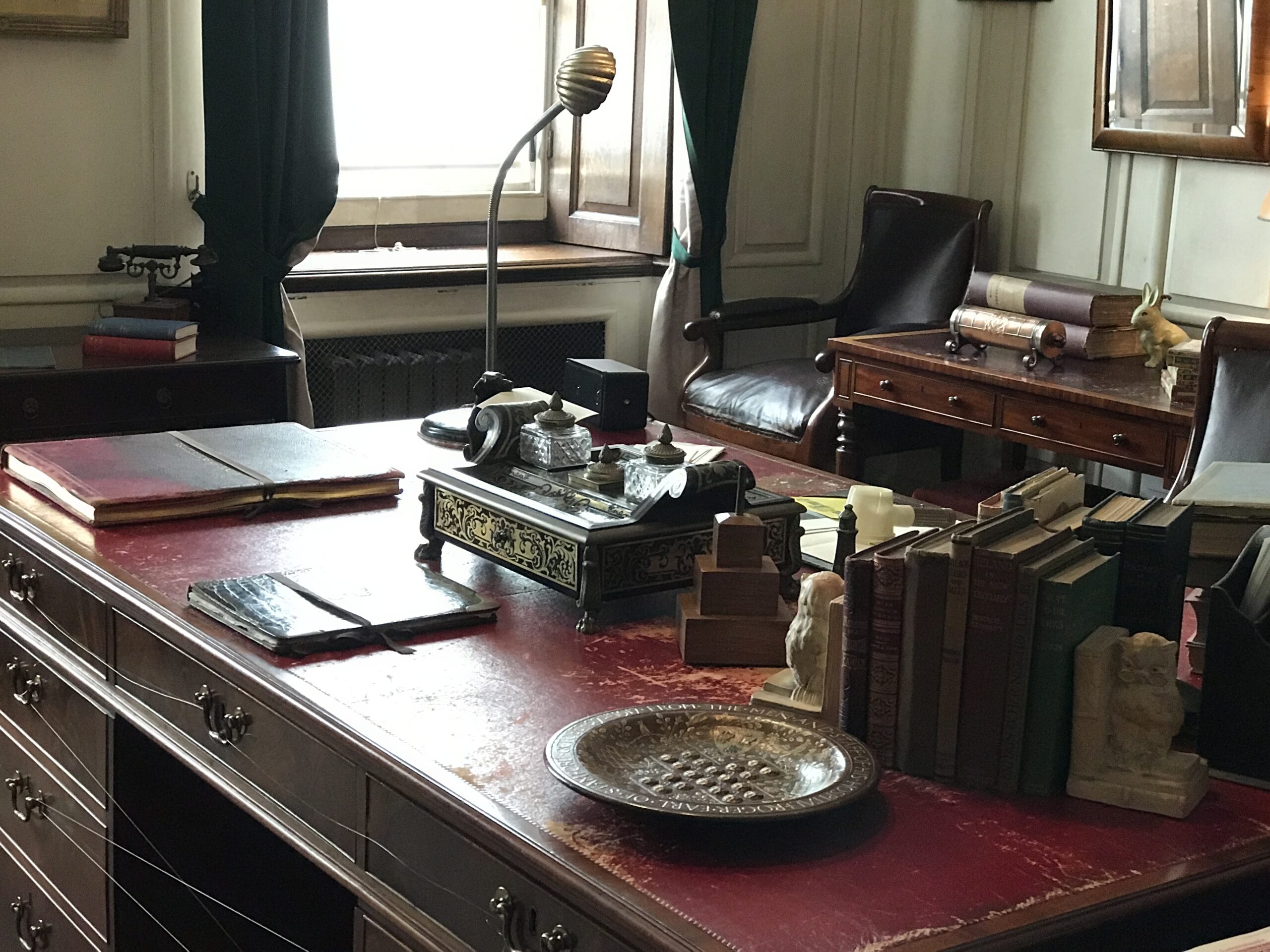 Photo of an old writer’s desk set in office