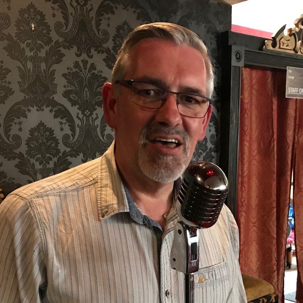 Photo of Seamus with microphone